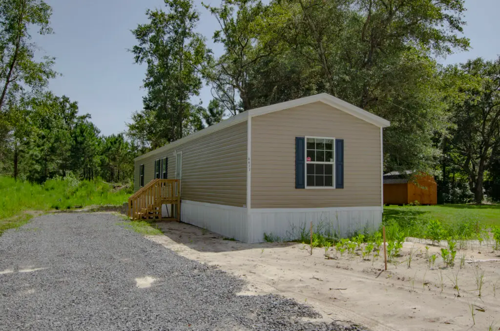 a house with a porch and a gravel road