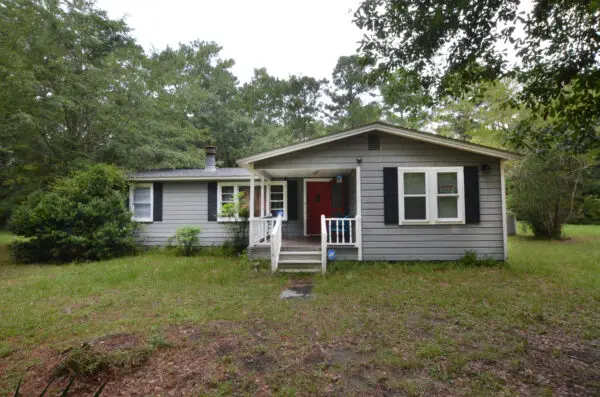 a house with a porch and a yard